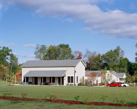 Out Building With Landscaped Grass Yard.