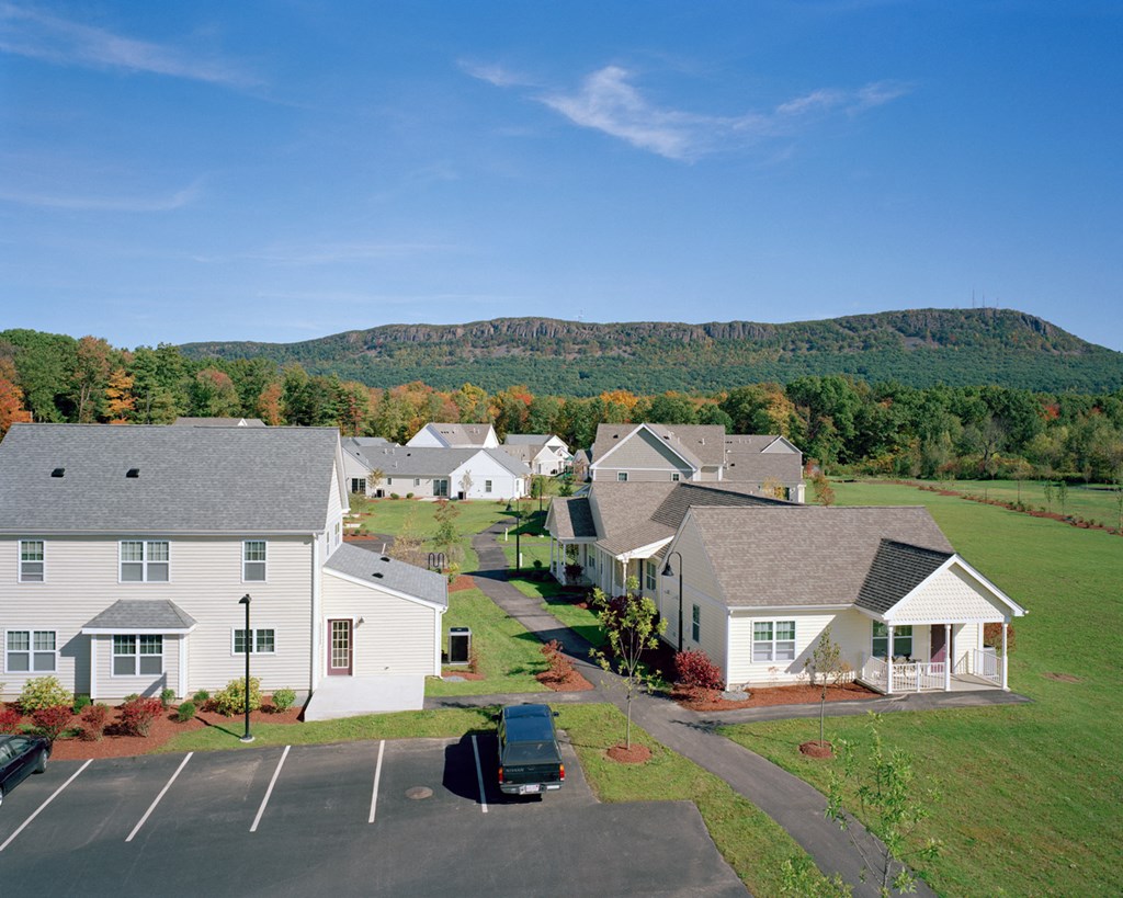 Outdoor Building With Landscaped Grass Yard.