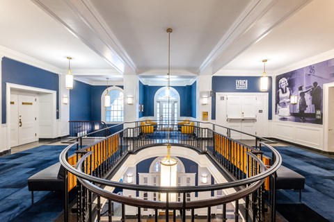 the interior of a building with a circular staircase and blue walls and white ceilings  at 140 Clarendon, Massachusetts, 02116