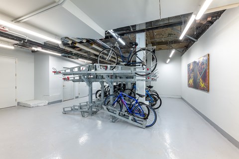 a group of bikes on a rack in a room  at 140 Clarendon, Boston, MA