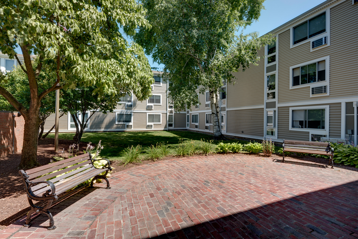 Courtyard with Bench  at Blake Estates Apartments in Hyde Park, Massachusetts