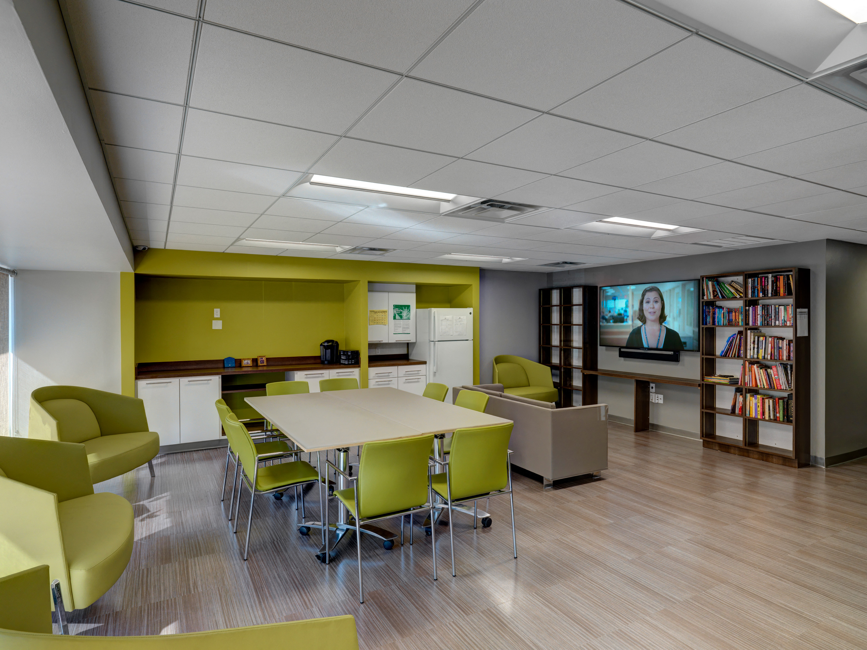 Community Room with TV and Library at Mandela Homes, Boston, MA.