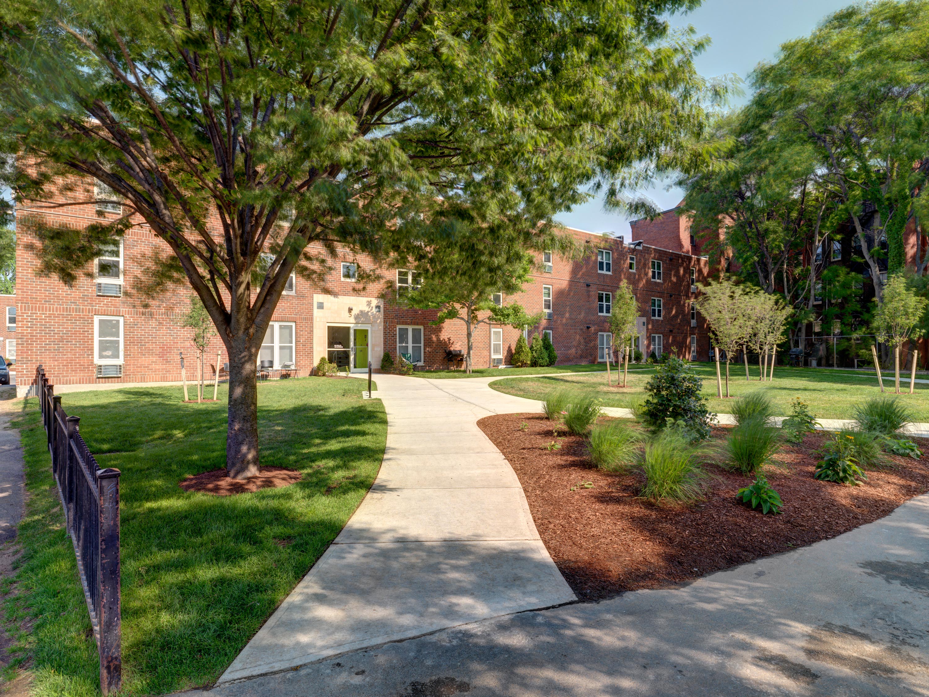 Community Courtyard with Walking Paths. at Mandela Homes, Massachusetts, 02118