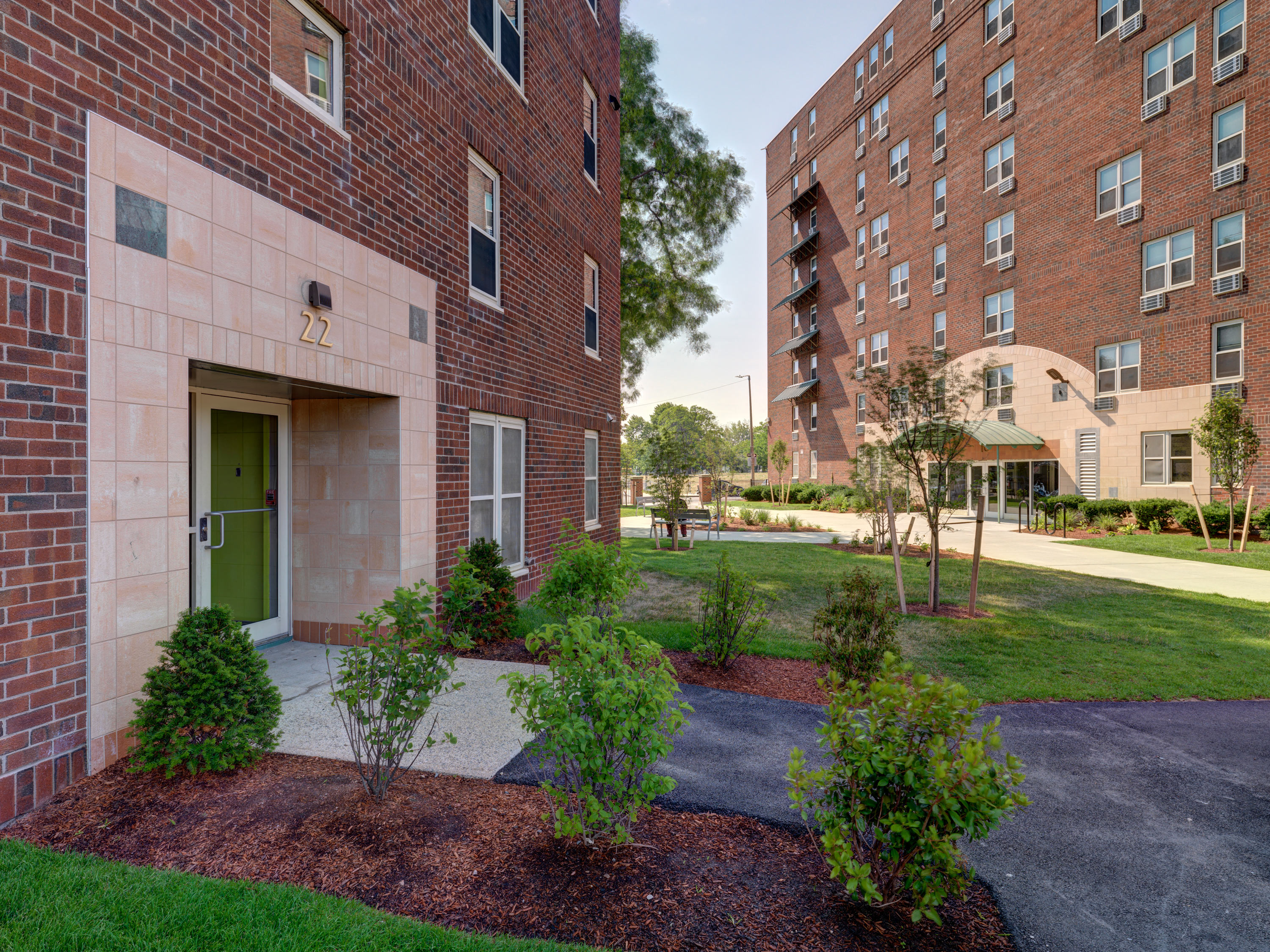 Building Side Entrance From Courtyard. at Mandela Homes, Massachusetts, 02118