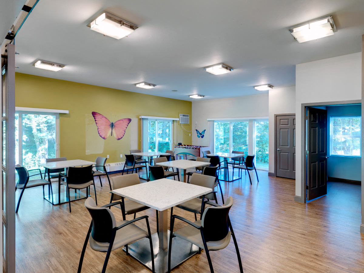 Community Room with Foosball Table at Wilkins Glen Apartments in Medfield, MA.