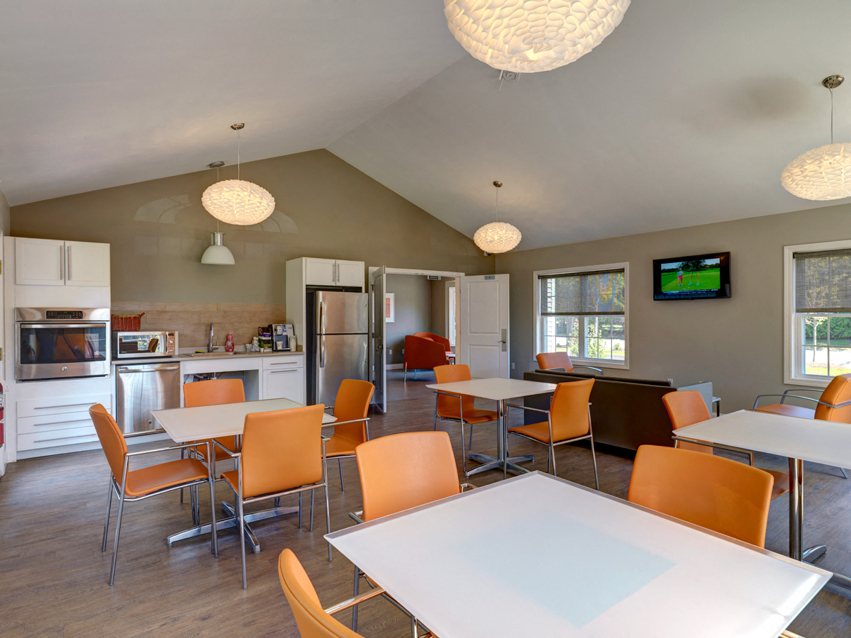 Community clubroom with kitchen at Mansfield Meadows Apartments in Mansfield, MA