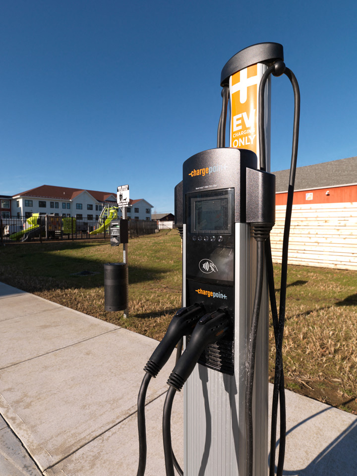 Electric car charging at North Square Apartments at The Mill District in Amherst, MA