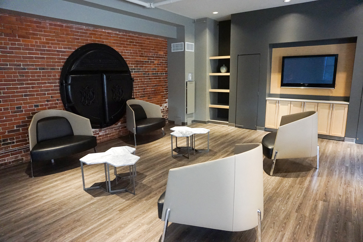 Community Clubhouse With Comfortable Tables And Chairs  at The Cordovan at Haverhill Station, Haverhill, 01830