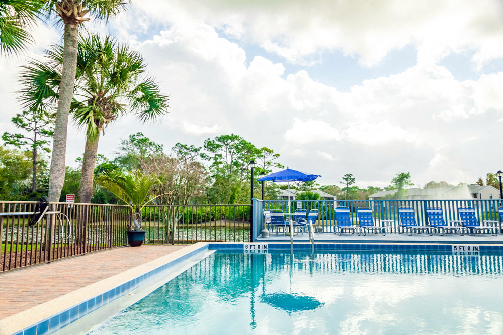 Outdoor Swimming Pool view at Fishermans Landing Apartments in Ormond Beach, FL.