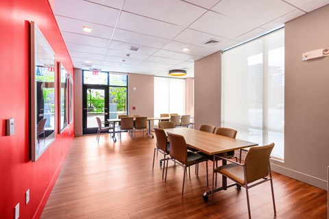 A conference room with a long table and chairs at Pok Oi Residences, Boston, MA, Massachusetts, 2111