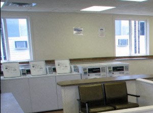 Community laundry suite at Coppermine Village Apartments in Bristol, CT.