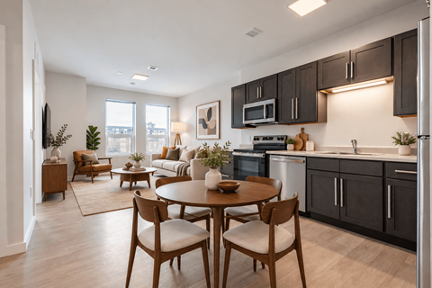 A modern kitchen with a dining table and chairs at The Atwater at Ninth Square Apartments, New Haven