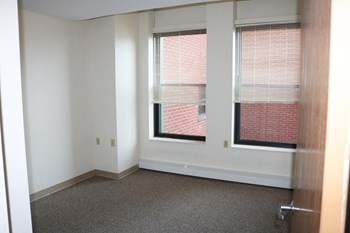 Bedroom With Large Windows and Blinds at Pequoig House in Athol, MA. - Photo Gallery 4