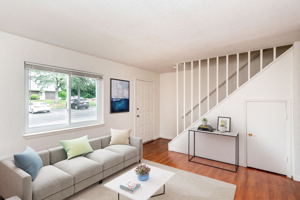 Living Room with Hardwood Floors and Stairs at Rolling Green Apartments, Amherst
