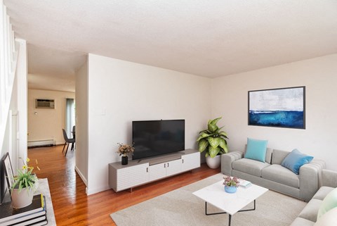 Living Room with Coffee Table and TV at Rolling Green Apartments, Amherst, Massachusetts