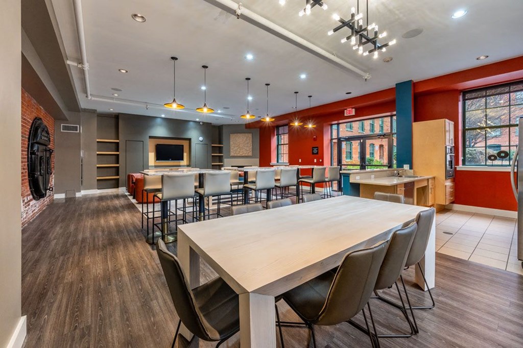 A large conference room with a long table and chairs at The Cordovan at Haverhill Station, Haverhill, MA