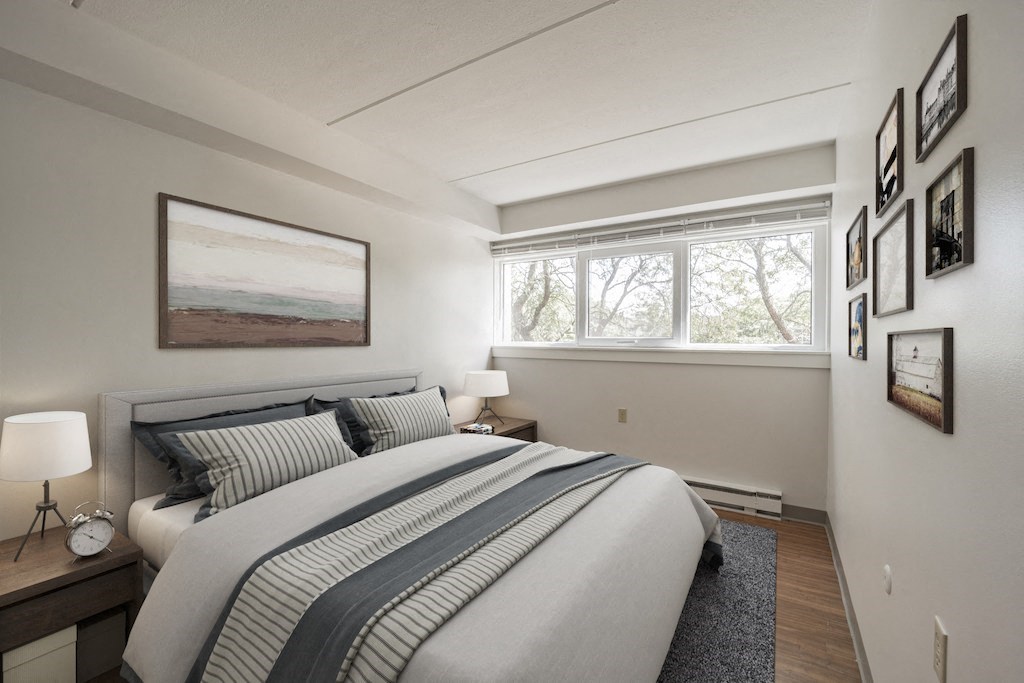 Bedroom with Windows and Bed at Baystate Place, Massachusetts