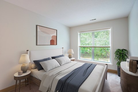 Modern bedroom with neutral decor at Woodlands at Abington Station Apartments, Massachusetts