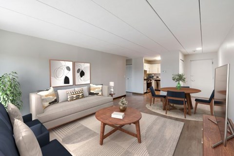 A living room with a sofa, chairs, and a coffee table at Stratton Hill Park Apartments in Worcester, MA