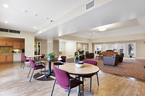 Resident Seating Area With Tables And Chairs at Creekwood Apartments, Watertown, NY.