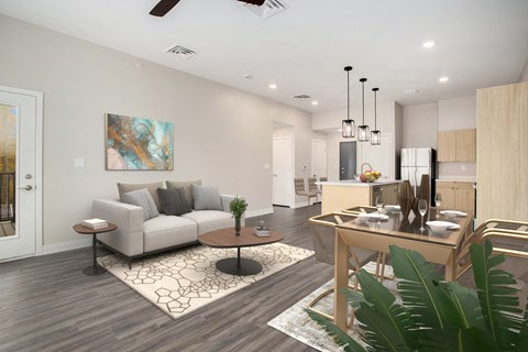 A modern living room with a grey sofa, a coffee table, and a painting on the wall.