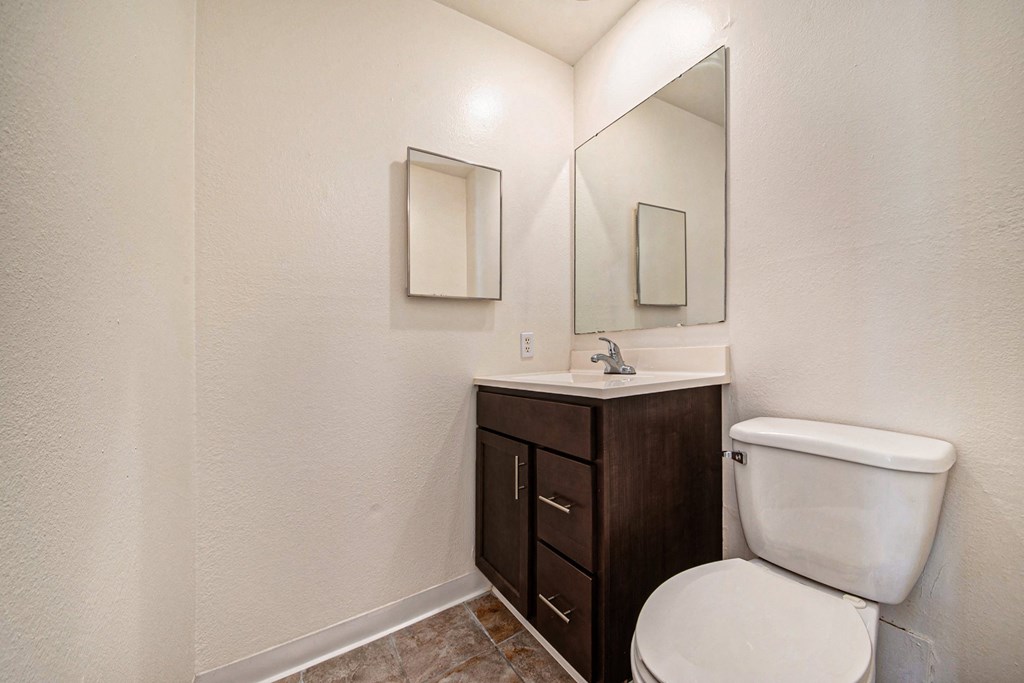 a bathroom with a toilet and a sink