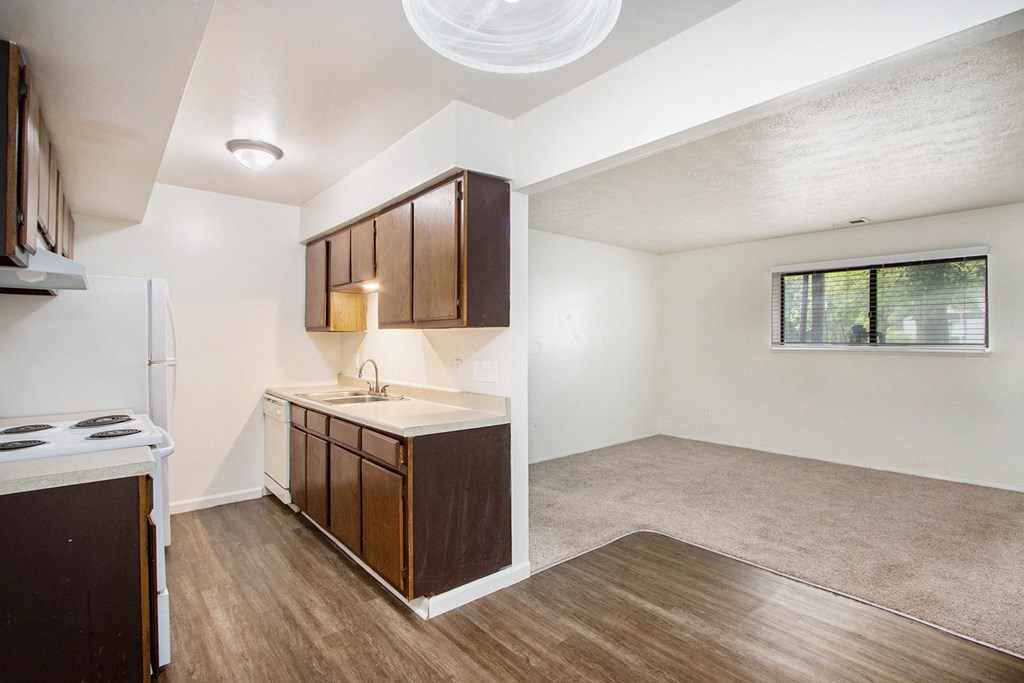 a kitchen and living room in a small apartment