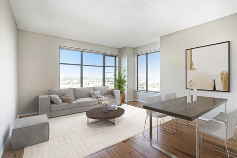 a living room with a couch and a dining table