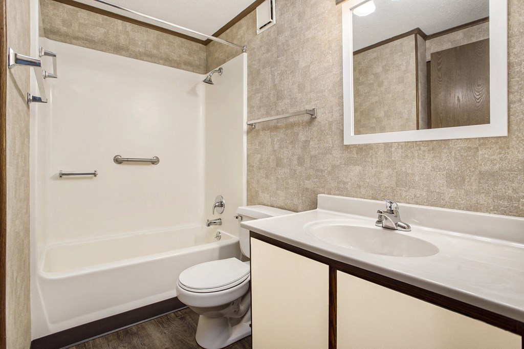 a bathroom with a sink toilet and bathtub