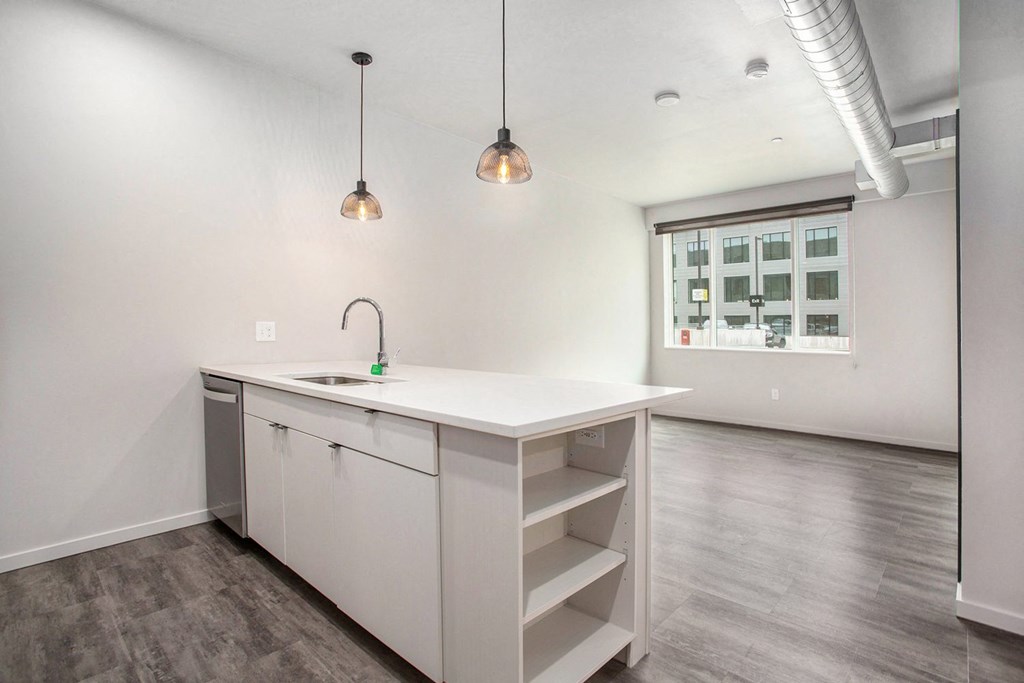 234 Market Apartments In Grand Rapids, MI With Renovated Kitchens featuring a quartz countertop island