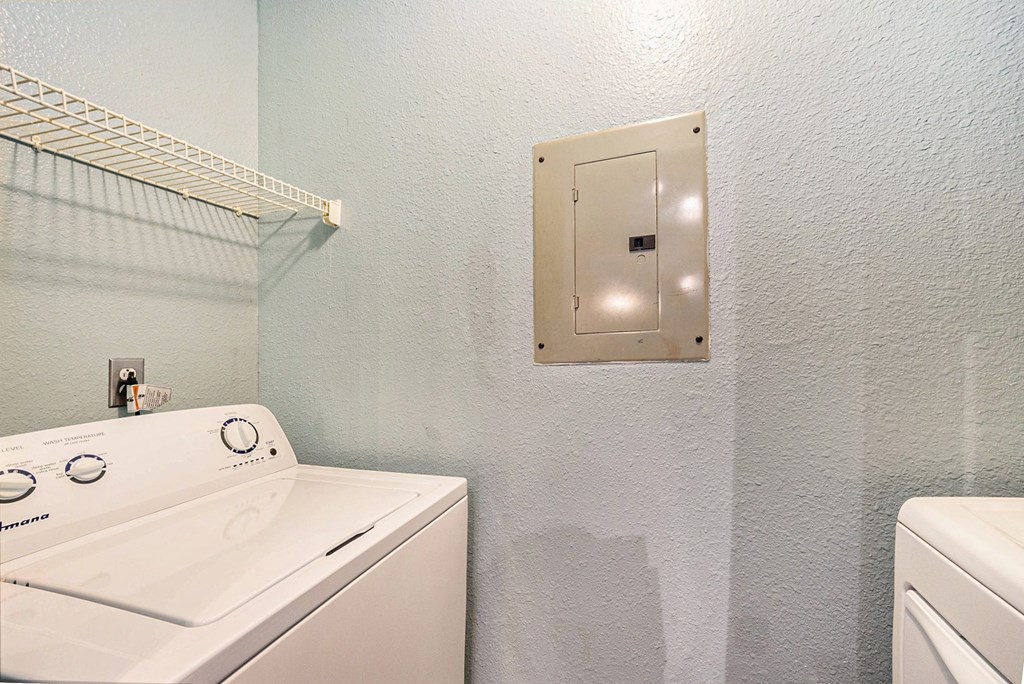 a laundry room with a washer and dryer