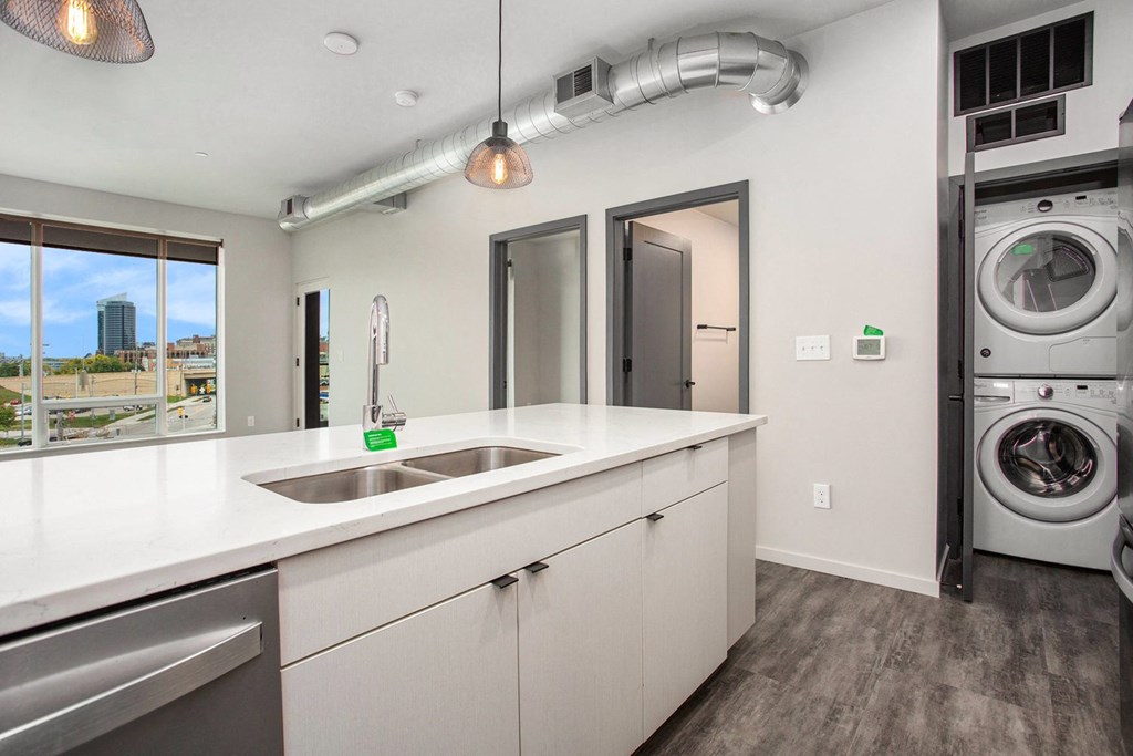 234 Market Apartments In Grand Rapids, MI With Renovated Kitchens featuring a quartz countertop island
