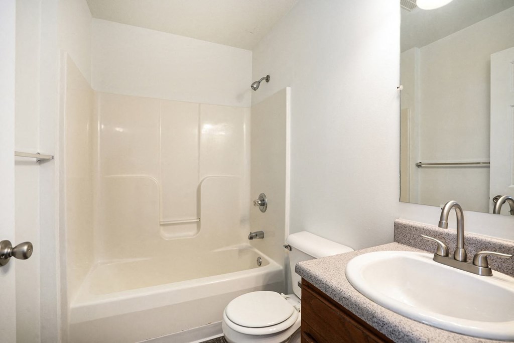 a bathroom with a sink toilet and bathtub