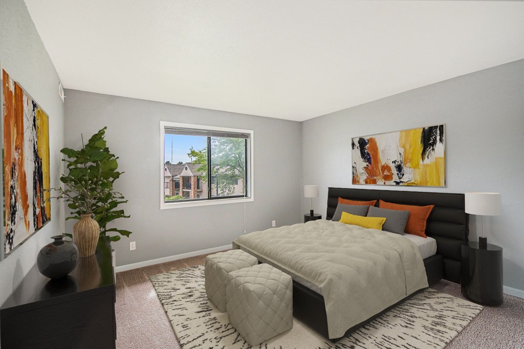 a bedroom with a bed and a window