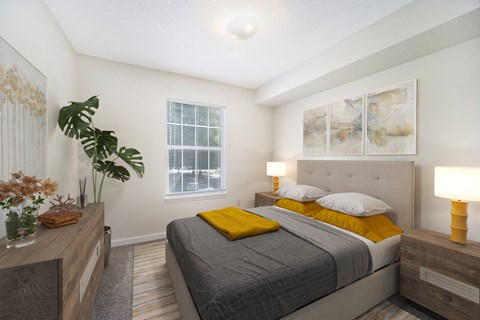 a bedroom with a bed and a dresser and a window