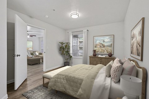 A bedroom with a bed, dresser, and painting on the wall.