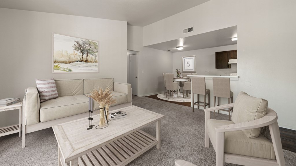 A living room with a couch, chairs, and a coffee table.