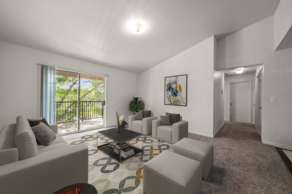 a living room with couches and a coffee table