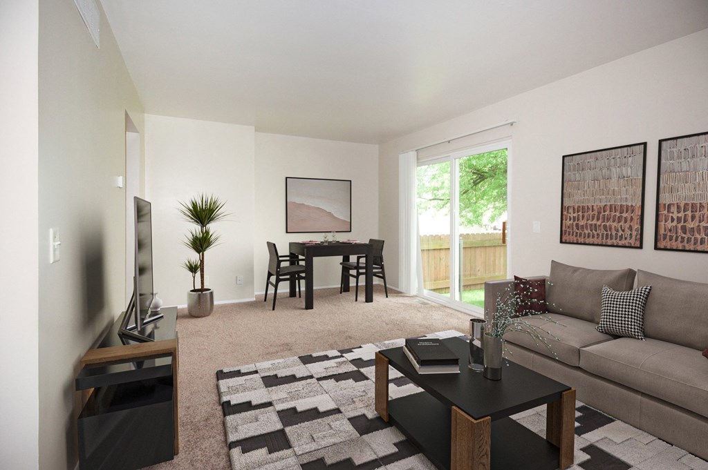 a living room with a couch and a table and a tv