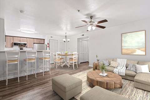 A living room with a brown coffee table and a white couch.