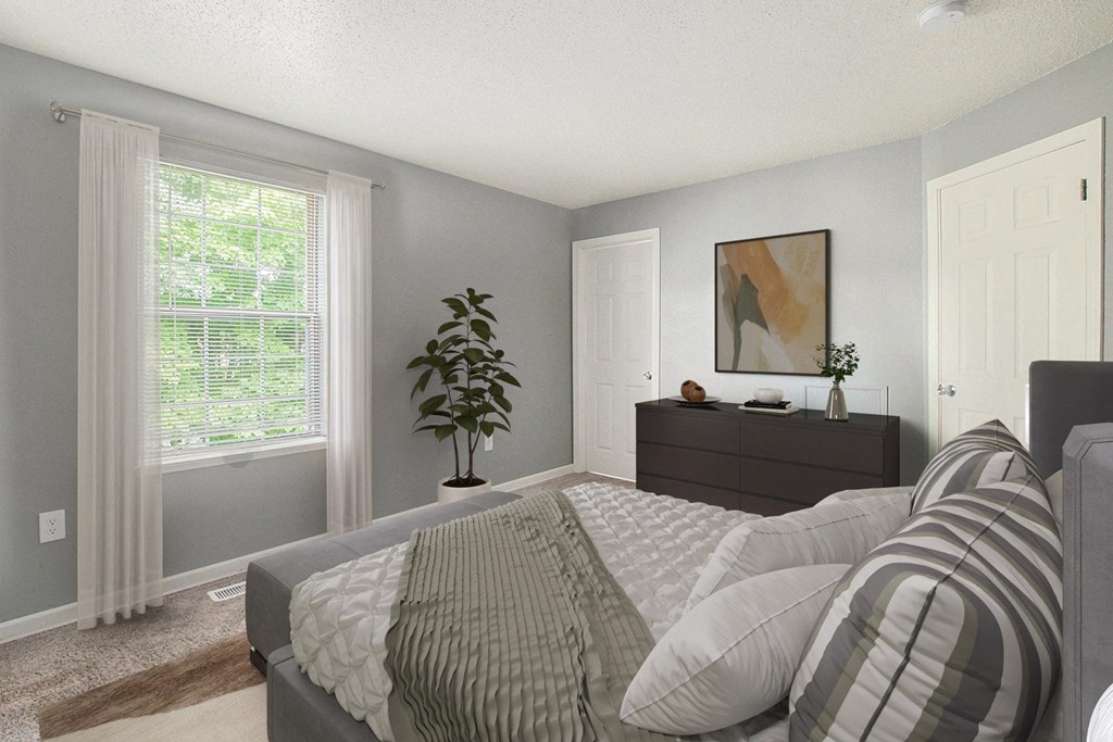 a bedroom with a bed and a dresser in the corner