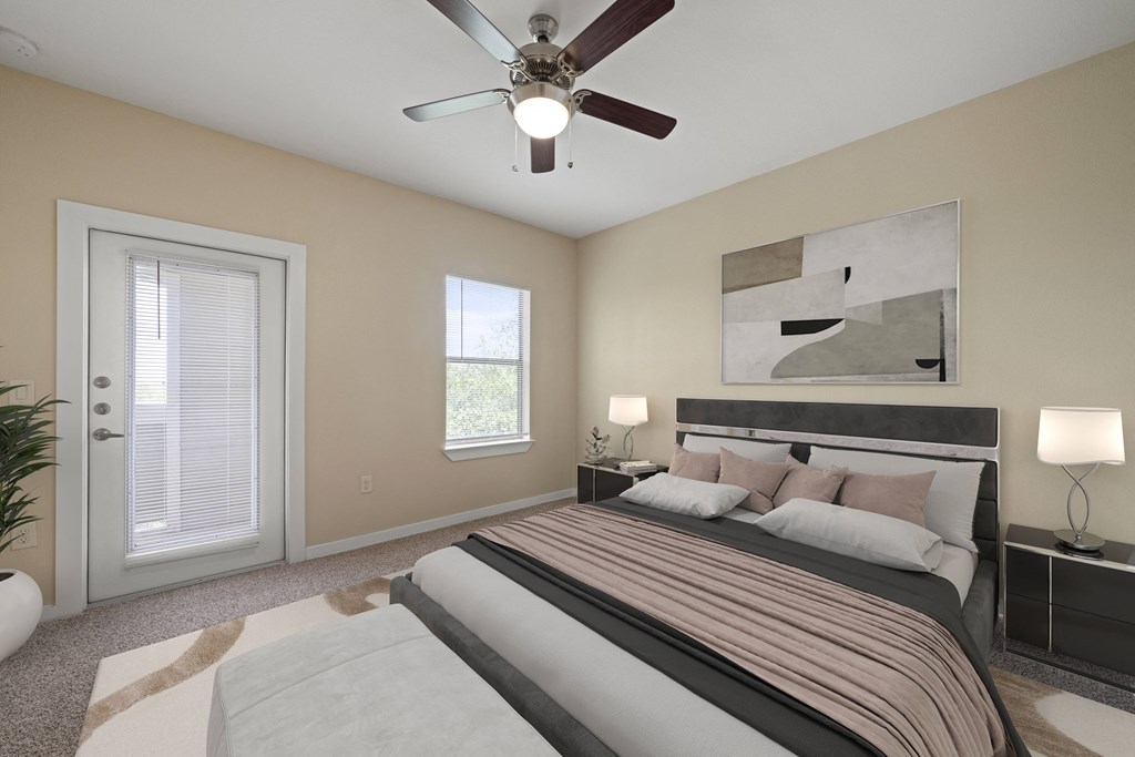 a bedroom with a large bed and a ceiling fan