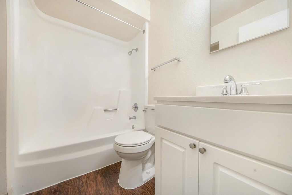 a bathroom with a toilet sink and bathtub
