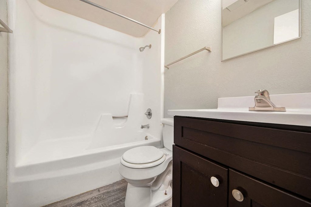 a bathroom with a sink toilet and bathtub