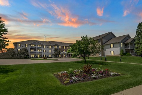 A building with a garden in front of it.