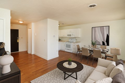 a living room and dining room with a couch and a table