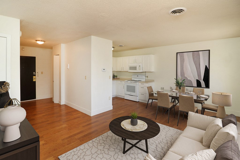 a living room and dining room with a couch and a table