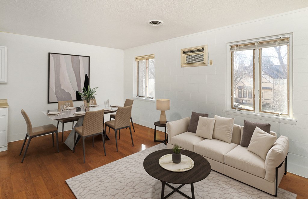 a living room and dining room with a couch and a table