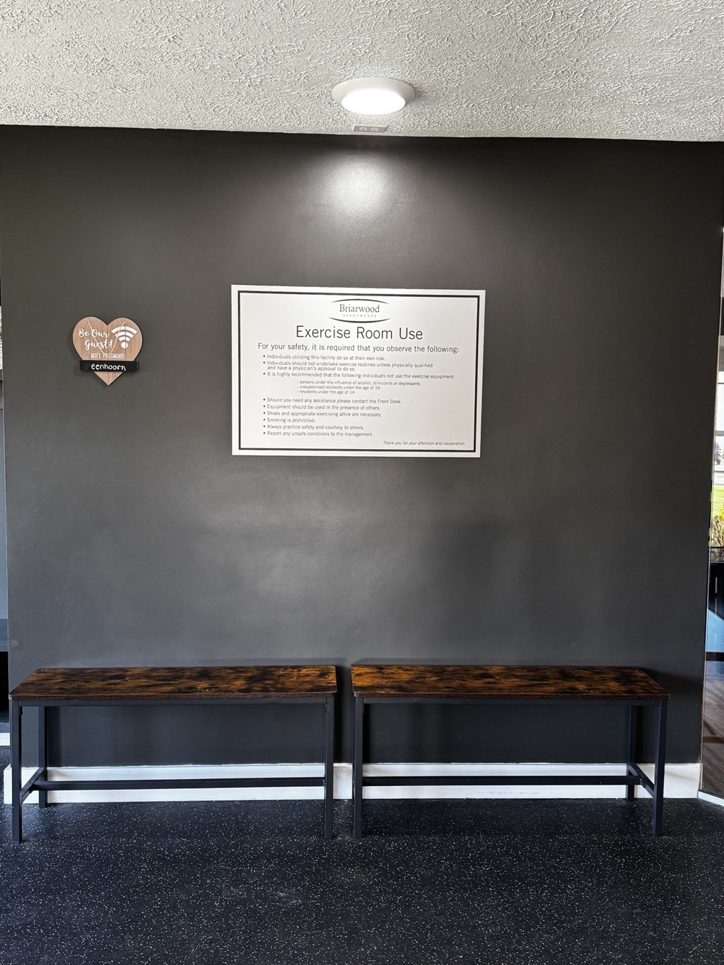 A wall with a sign that says Exercise Room Use.