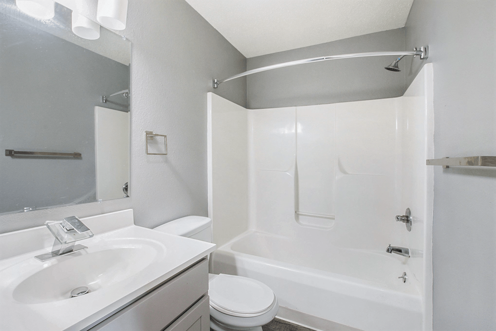 a bathroom with a sink toilet and bathtub